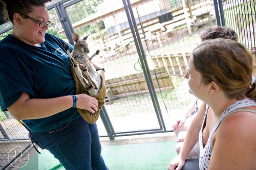 Amanda Beck (left) introduces a red kangaroo to Monica Hamm (right) and her mother Barbara during an encounter program at the North Georgia Zoo and Petting Farm in Cleveland on Sunday, August 10, 2014. 