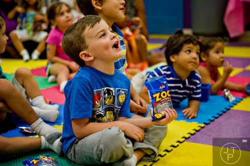 Lucas Deal listens to story time at Catch Air in Johns Creek on Thursday, August 14, 2014.  