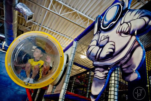 Paul Grobler (left) hangs out in the three story space tower at Catch Air in Johns Creek on Thursday, August 14, 2014.  