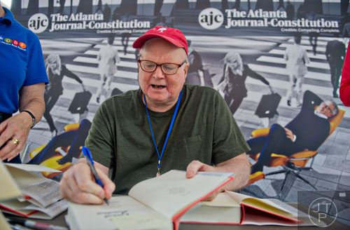 Author Pat Conroy signs books for fans during the AJC Decatur Book Festival on Saturday, August 30, 2014. 