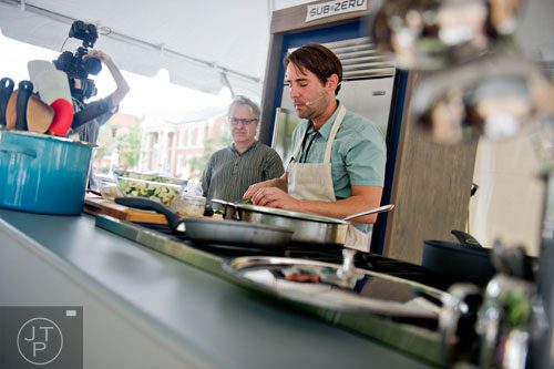 Brys Stephens (right) demonstrates how to cook using pablano peppers as Atlanta Journal-Constitution dining critic, John Kessler, watches during the AJC Decatur Book Festival on Saturday, August 30, 2014. 
