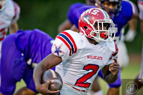 Dunwoody's Tylor Scales (2) moves the ball down the field during their game against Lakeside-Dekalb on Friday, September 19, 2014.  