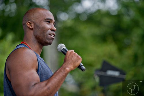 Former NFL linebacker Keith Mitchell tells the story of his paralyzing injury and his recovery through meditation and yoga during Wanderlust 108 at Piedmont Park in Atlanta on Sunday, September 28, 2014. 