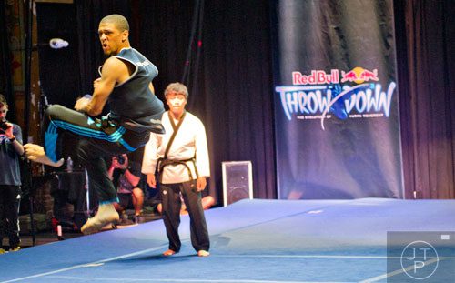 Jefferson Lewis (left) flies through the air as he competes against Mincheol Shin in the Red Bull Throwdown Atlanta at the Tabernacle in Atlanta on Sunday, September 28, 2014. 