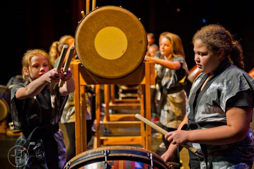 Kennedy Hensley (right) and Falon Tomlin play Taiko drums during the 2014 JapanFest at the Gwinnett Center in Duluth on Saturday, September 20, 2014. 