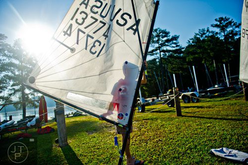 Will Weinbecker walks his mast and sail to his dinghy during the 2014 USODA Southeast Championship at Lake Allatoona in Acworth on Sunday, September 21, 2014. 