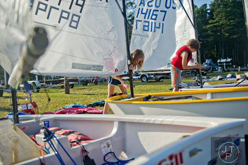 Bridget Monahan (left) and her brother Reedy put their masts on their dinghys during the 2014 USODA Southeast Championship at Lake Allatoona in Acworth on Sunday, September 21, 2014. 