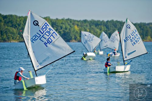 Louis La Fontisee (left) makes his way to the starting line for the start of the 2014 USODA Southeast Championship at Lake Allatoona in Acworth on Sunday, September 21, 2014. 