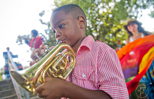 August Murray plays a trumpet during the AJC Decatur Book Festival on Saturday, August 30, 2014.