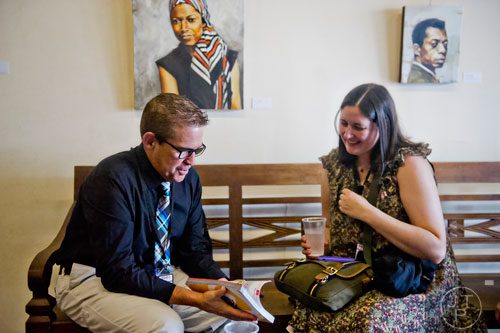 Authors Andrew Smith (left) and Jennifer E. Smith talk inside the hospitality suite during the AJC Decatur Book Festival on Saturday, August 30, 2014.
