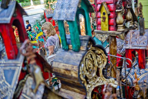 Yogi Richard looks at pieces of artwork during the 46th annual Yellow Daisy Festival at Stone Mountain Park on Saturday, September 6, 2014.