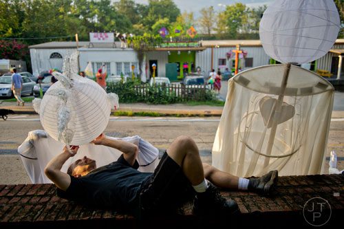 Marc Fayard makes last minute adjustments as he waits for the start of the Atlanta Beltline Lantern Parade on Saturday, September 6, 2014. 