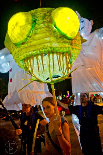 Melissa Anziano (center) carries a fish lantern towards Park Tavern after finishing the Atlanta Beltline Lantern Parade on Saturday, September 6, 2014. 