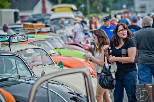 Amanda Stolte (left) and her mother Janine check out Volkswagen beetles during the 11th Annual Flowery Branch Car Show and Chili Cook Off on Saturday, September 13, 2014. 