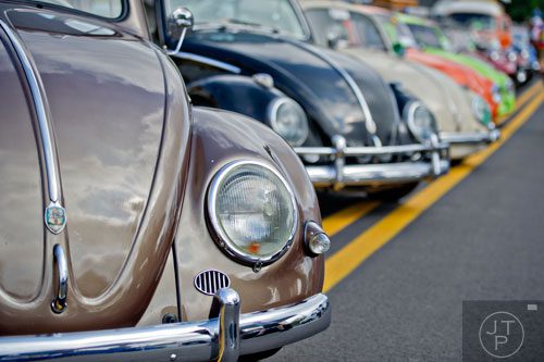 A 1956 Volkswagen beetle (left) sits in the front of a line of the classic car during the 11th Annual Flowery Branch Car Show and Chili Cook Off on Saturday, September 13, 2014. 