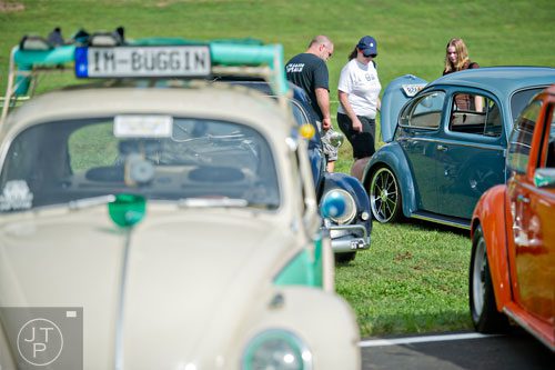 Gary Appling (left), his wife Patty and daughter Lauren check out classic Volkswagen beetles during the 11th Annual Flowery Branch Car Show and Chili Cook Off on Saturday, September 13, 2014. 