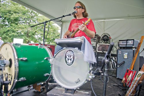 Mike Snowden  performs on the live music stage during the Atlanta Arts Festival at Piedmont Park on Saturday, September 13, 2014. 