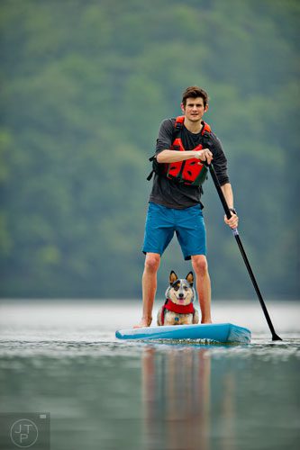 Tyler Legg and his Austrailian cattle dog Kora paddle board on the Chattahoochee River on Tuesday, August 19, 2014.