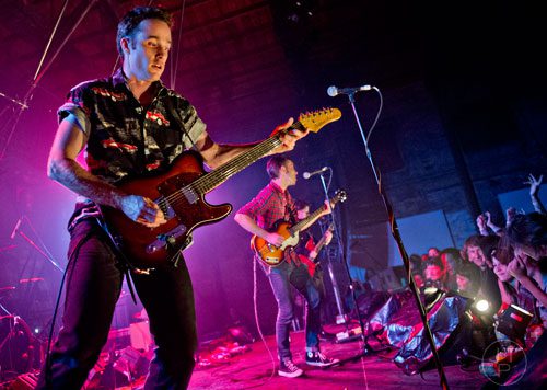 Jack Hines (left), Jared Swilley and Cole Alexander from the band The Black Lips perform on stage at The Goat Farm in Atlanta on Saturday, October 4, 2014. 