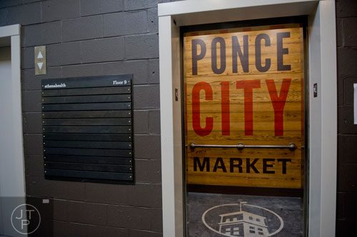 A placard with athenahealth on it sits by the elevators leading up to the 75,000 square foot offices at Ponce City Market in Atlanta on Tuesday, September 30, 2014. 
