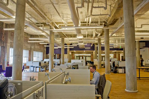 Jim Dobbins works at his cubicle in the 75,000 square foot offices of athenahealth at Ponce City Market in Atlanta on Tuesday, September 30, 2014. 