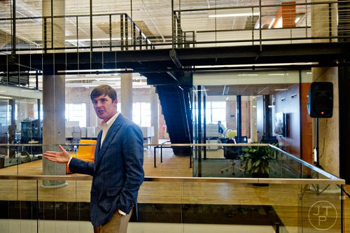 David Harvey (left) gives a tour of the 75,000 square foot offices of athenahealth at Ponce City Market in Atlanta on Tuesday, September 30, 2014. 