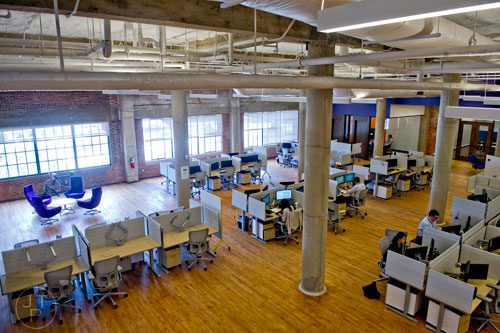 Employees work in the 75,000 square foot offices of athenahealth at Ponce City Market in Atlanta on Tuesday, September 30, 2014. 