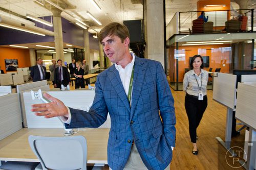 David Harvey (center) gives a tour of the 75,000 square foot offices of athenahealth at Ponce City Market in Atlanta on Tuesday, September 30, 2014. 