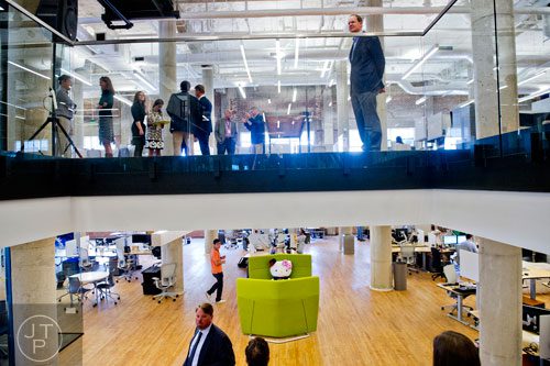 James Irwin (top right) and Michael Phillips (bottom left) check out the 75,000 square foot offices of athenahealth at Ponce City Market in Atlanta on Tuesday, September 30, 2014. 