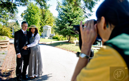 Jeff Hansen (left) and Dona Kramer pose for a photo taken by Julie Love at Oakland Cemetery in Atlanta during the 35th annual Sunday in the Park on Sunday, October 5, 2014. 