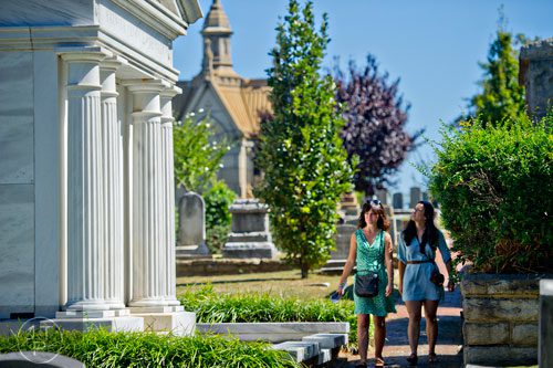 Emilee Patterson (left) and Liz Evans walk through Oakland Cemetery in Atlanta during the 35th annual Sunday in the Park on Sunday, October 5, 2014. 