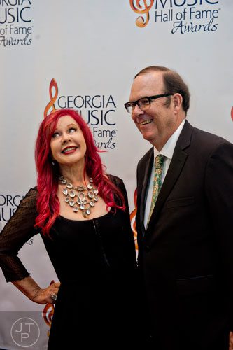 Kate Pierson (left) from The B-52s walks the red carpet with Danny Beard for the 2014 Georgia Music Hall of Fame Awards at the Georgia World Congress Center in Atlanta on Saturday, October 11, 2014.  
