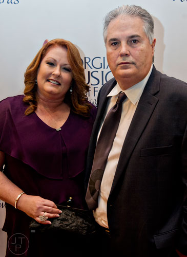 Charlie Brusco (right) walks the red carpet with his wife Cindy for the 2014 Georgia Music Hall of Fame Awards at the Georgia World Congress Center in Atlanta on Saturday, October 11, 2014.