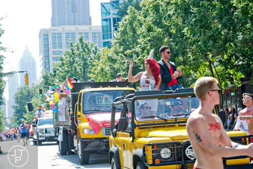 Calisto (right) and Saphire ride a float down Peachtree St. during the Atlanta Pride Parade on Sunday, October 12, 2014. 