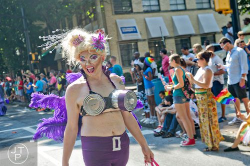 Betty Bennett marches down Peachtree St. during the Atlanta Pride Parade on Sunday, October 12, 2014. 