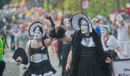 Sister Spanks de Boys (center) waves to the crowd as shel marches down 10th St. during the Atlanta Pride Parade on Sunday, October 12, 2014. 
