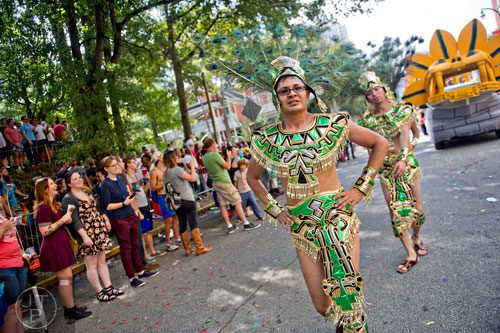 Anatolio Leal marches down 10th St. during the Atlanta Pride Parade on Sunday, October 12, 2014. 