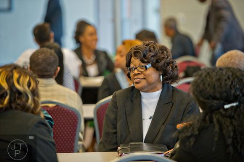 Gloria Ward (center) waits with other hopeful applicants for the start of the South Clayton Job Fair at the South Clayton Recreation Center in Hampton on Tuesday, September 30, 2014. 
