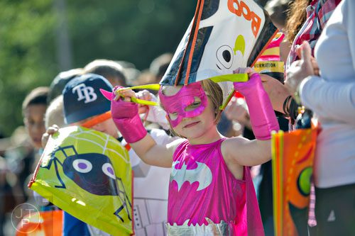 Hannah Kirkland (right) plays with her candy bag during the 14th annual Little 5 Points Halloween Parade in Atlanta on Saturday, October 18, 2014. 