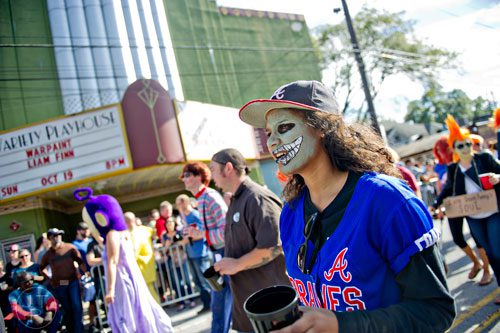 Alex Lobban (center) marches in the 14th annual Little 5 Points Halloween Parade in Atlanta on Saturday, October 18, 2014. 