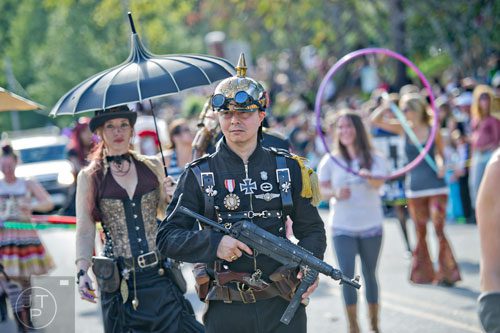 David Doust (center) marches in the 14th annual Little 5 Points Halloween Parade in Atlanta on Saturday, October 18, 2014. 