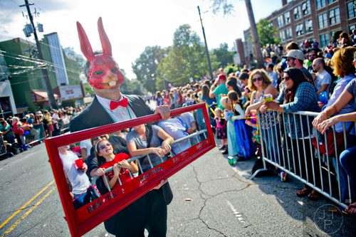 Frank Mahieu (left) holds a mirror as he marches in the 14th annual Little 5 Points Halloween Parade in Atlanta on Saturday, October 18, 2014. 
