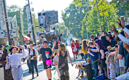 An AT-ST from the Star Wars saga makes its way up Euclid Ave. during the 14th annual Little 5 Points Halloween Parade in Atlanta on Saturday, October 18, 2014. 