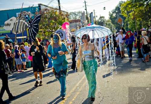 Susan Tamasi (right) marches in the 14th annual Little 5 Points Halloween Parade in Atlanta on Saturday, October 18, 2014. 