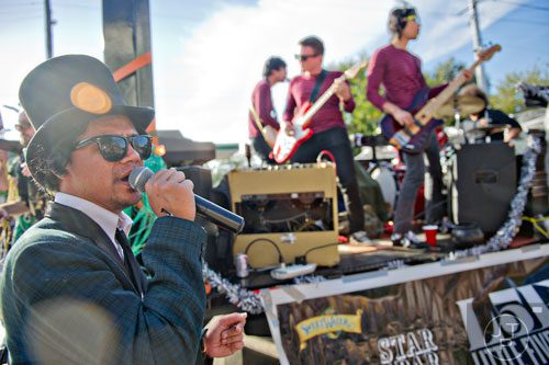 Andrew Longino sings as the Disapyramids play during the 14th annual Little 5 Points Halloween Parade in Atlanta on Saturday, October 18, 2014. 