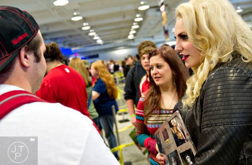 Jackie Jones (right) waits in line for autographs from members of the cast of The Walking Dead during Walker Stalker Con in Atlanta on Sunday, October 19, 2014.
