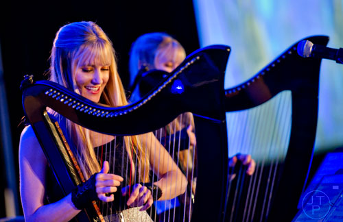 The Harp Twins, Kennerly Kitt (left) and her sister Camille, perform during Walker Stalker Con in Atlanta on Sunday, October 19, 2014. 