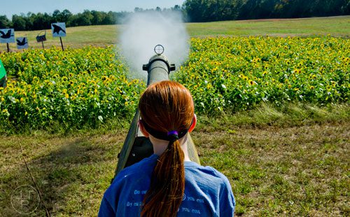 Molly Henkes fires a water bottle out of an air cannon at Corn Dawgs in Loganville on Sunday, October 5, 2014.
