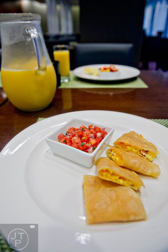 Egg and ham quesadillas with pico de gallo sit on a plate at The Cafe inside the Westin Peachtree Plaza hotel in Atlanta on Wednesday, October 8, 2014. 