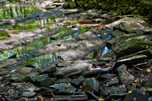 Water flows past rocks and the ruins of the New Manchester Mill at Sweetwater Creek State Park in Lithia Springs on Monday, September 22, 2014.